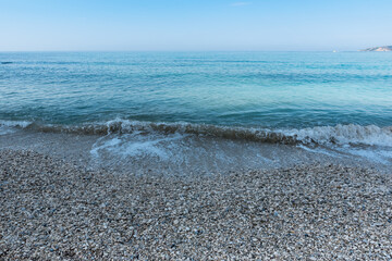 Sea waves on the pebble beach