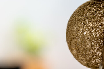Close-up view of a decorative spherical lamp in the garden
