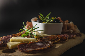 Mediterranean platter. Spanish tapas and italian antipasti. Cheese, olives, chorizo, tomatoes, tenderloin, salchichon and prosciutto.