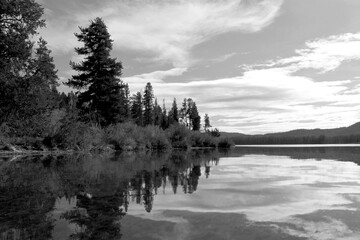 Black & white ocean and lake scenes with dynamic active cloudy skies and water reflections