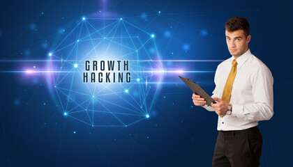 Businessman thinking about security solutions with GROWTH HACKING inscription