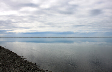 Fototapeta na wymiar Pristine water scenes with reflections and brilliant blue skies