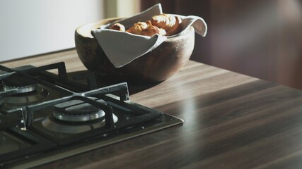 Croissants in the wooden bowl at the kitchen