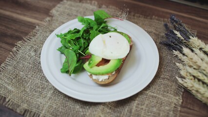Top view of Bruschetta with Salmon, Avocado, cottage cheese and Poached Egg