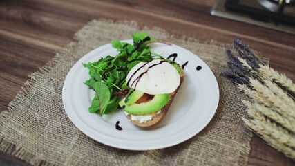 Top view of Bruschetta with Salmon, Avocado, cottage cheese and Poached Egg