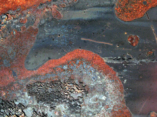 Rusted metal objects from vehicles and architecture with oxidation and traces of paint
