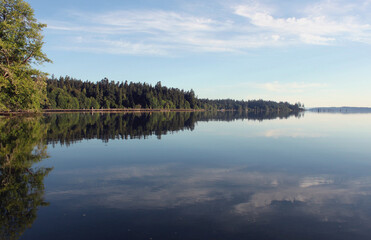 Fototapeta na wymiar Pristine water scenes with reflections and brilliant blue skies