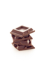 Cubes of dark chocolate white background