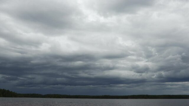 Heavy Rain Clouds Before A Storm.  Action over the skies over the lake prior to a summer storm.