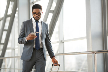 Businessman Texting On Smartphone In Airport Indoor Making Business Trip