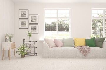 White living room with sofa and summer landscape in window. Scandinavian interior design. 3D illustration