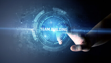 Hand touching TEAM BUILDING button, modern business technology concept