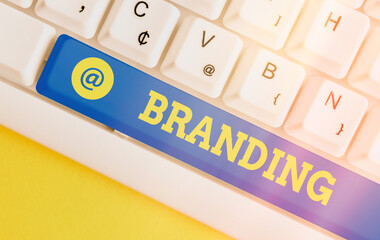 Writing note showing Branding. Business concept for the promoting of a product or service of a...