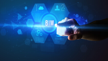 Hand touching BIM inscription, new technology concept