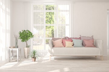 White living room with sofa and summer landscape in window. Scandinavian interior design. 3D illustration