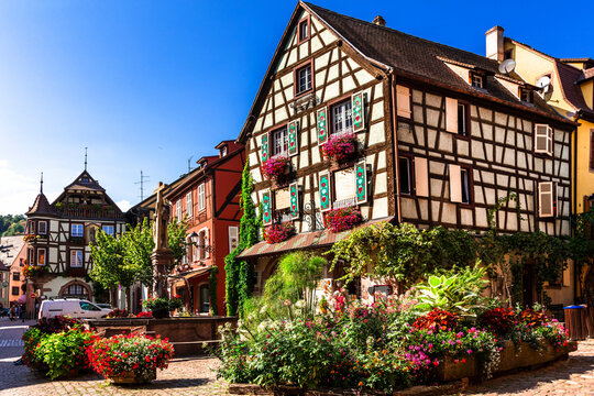 Cozy Floral Village Kaysersberg Alsace France Traditional Half-Timbered Houses with Colorful Shutters and Vibrant Flower Decorations Scenic Wine Route Tourism one of the most beautiful villages 