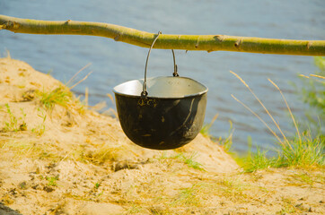  camping cauldron. cauldron at the stake. rest by the river