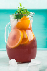 Fresh red coktail sangria in pitcher and glasses