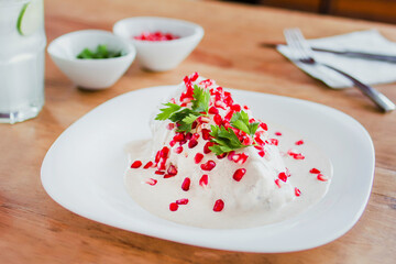 chiles en nogada, traditional Mexican dish with poblano chili peppers and walnut sauce from Puebla...