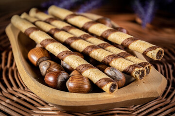 Sweet spiral tubes with nuts cream.