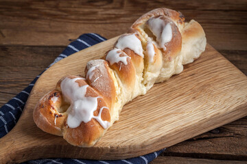 Sweet bun on a cutting board.