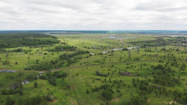 landscape with electrical towers and constriction site