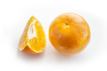 Orange and its part on white background