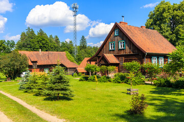 Fototapeta na wymiar Old traditional rural houses in Krutyn village near lake Mokre, Masurian Lakes, Poland