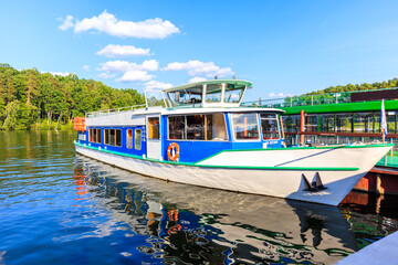 Tourist ship mooring in small port in Ruciane Nida, Masurian Lakes, Poland