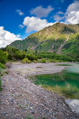 Fototapeta na wymiar Amazing view of a mountain lake in front of a mountain range, Almaty city national park, Kazakhstan
