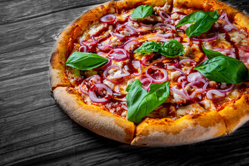 Pizza with chicken and barbeque sauce . Italian pizza on wooden table background