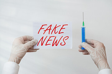 Word writing text Fake News. Business photo showcasing false information publish under the guise of...
