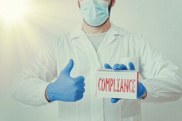 Conceptual hand writing showing Compliance. Concept meaning ability of an object to yield...