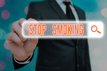 Writing note showing Stop Smoking. Business concept for the process of discontinuing or quitting...