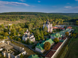 Flight over a christian monastery surrounded by autumn forest. Kurky monastery, Moldova republic of. © Igor Syrbu