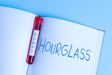 Writing note showing Hourglass. Business concept for instrument for measuring time consisting of a...