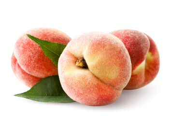Ripe peaches with green leaves on a white background. Isolated