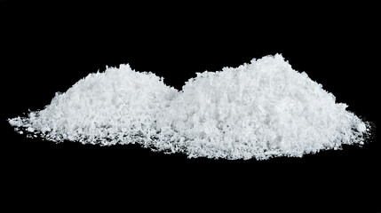 Pile of snow isolated on a black background. Snowdrifts.