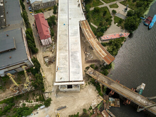 Aerial drone view. Construction of a bridge across the Dnieper river in Kiev.