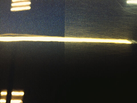 Polishing car - difference befora and after. Swirl marks and scratches and mirror glaze at polished car paint body