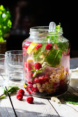 Infused water in jar on wooden table
