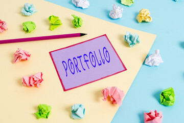 Conceptual hand writing showing Portfolio. Concept meaning securities held by an investor, paper...