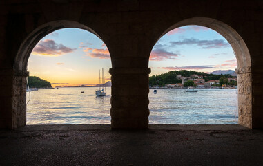 Sea view through two arches of the gallery. Cavtat, Dubrovnik, Croatia.