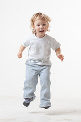 happy child jumping on white background