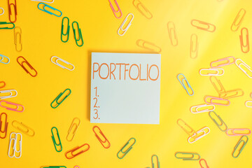 Writing note showing Portfolio. Business concept for securities held by an investor, paper held by...