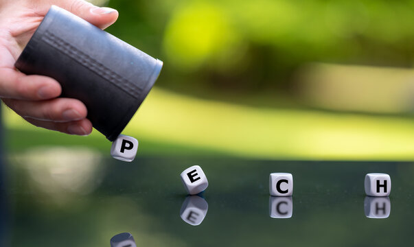 Symbol for having bad luck. Hand rolls the dice which form the German word "Pech" (bad luck).