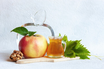 Apples and honey. Concept for Rosh Hashanah the Jewish New Year,  close up on white background.