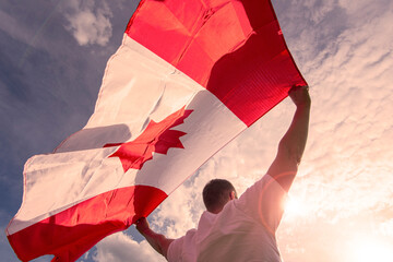 Man holding The National Flag of Canada 