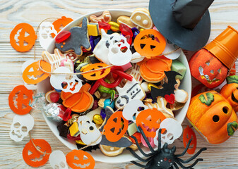 Halloween Jack o Lantern candy bowl with candy and halloween cookies Trick or Treat on white background