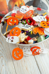 Halloween Jack o Lantern candy bowl with candy and halloween cookies Trick or Treat on white background